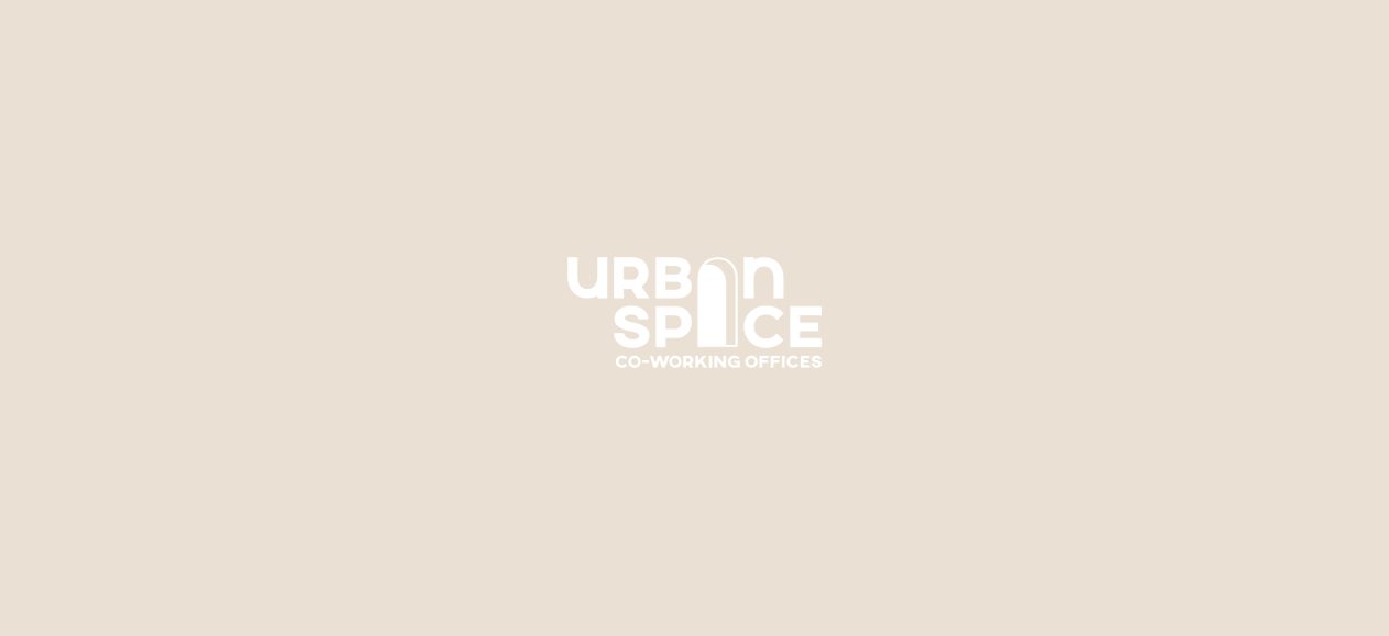 Urban Space co-working offices logo in white on sand, with an arched doorway forming the letter A